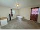 Simple bedroom with an unmade bed and red floral curtains, ideal for a guest room or room at 9621 Gemini Dr, Indianapolis, IN 46229