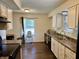 Charming kitchen featuring white cabinets and modern appliances, with a view to the outside at 9621 Gemini Dr, Indianapolis, IN 46229