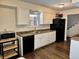 Functional kitchen with white cabinets, a black refrigerator, and modern appliances at 9621 Gemini Dr, Indianapolis, IN 46229