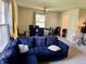 Inviting living room showcases a comfortable blue sofa and a dining area with modern chairs at 9621 Gemini Dr, Indianapolis, IN 46229