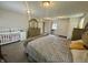 Spacious main bedroom with an ornate gold bed frame and lots of room for furniture at 9621 Gemini Dr, Indianapolis, IN 46229