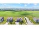 An aerial view shows a well-planned community, with neatly arranged homes backing onto a large green space at 9986 Gallop Ln, Fishers, IN 46040