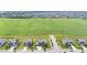 An aerial view shows a well-planned community, with neatly arranged homes backing onto a large green space at 9986 Gallop Ln, Fishers, IN 46040