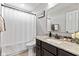 Cozy bathroom with granite counter top, dark cabinets, and a shower with bathtub at 9986 Gallop Ln, Fishers, IN 46040