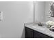 Elegant powder room featuring granite countertop and stylish faucet at 9986 Gallop Ln, Fishers, IN 46040