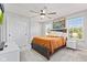Bedroom with ceiling fan, carpet, natural light, and closet in a neutral color scheme at 9986 Gallop Ln, Fishers, IN 46040