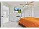 Bedroom with ceiling fan, carpet, natural light, closet, and wall mounted television at 9986 Gallop Ln, Fishers, IN 46040