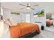 Bright bedroom with ceiling fan, carpet, natural light, and wall mounted television at 9986 Gallop Ln, Fishers, IN 46040