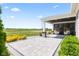 Inviting patio with pavers and wicker chairs, offering a serene outdoor living space at 9986 Gallop Ln, Fishers, IN 46040