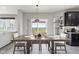 Open dining room with large table, chairs and natural light at 9986 Gallop Ln, Fishers, IN 46040