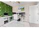 Bright home office featuring an accent wall, a monitor array, and a functional layout at 9986 Gallop Ln, Fishers, IN 46040