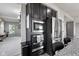 Modern kitchen featuring stainless steel appliances, built-in microwave, and dark cabinets at 9986 Gallop Ln, Fishers, IN 46040
