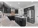 Gourmet kitchen with island, stainless steel appliances, and ample counter space at 9986 Gallop Ln, Fishers, IN 46040