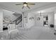 Spacious living area with carpet, open floor plan, and modern fixtures at 9986 Gallop Ln, Fishers, IN 46040
