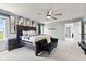Spacious main bedroom with stylish decor, a dark bed frame, and natural light at 9986 Gallop Ln, Fishers, IN 46040