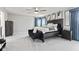 Spacious main bedroom with stylish decor, a dark bed frame, and natural light at 9986 Gallop Ln, Fishers, IN 46040