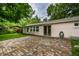 Back of house with brick patio and large backyard at 10155 Orchard Park W Dr, Carmel, IN 46280
