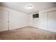 Spacious bedroom with carpet flooring, closet doors, and neutral paint at 10155 Orchard Park W Dr, Carmel, IN 46280