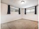 Bedroom with neutral walls, carpet flooring, and window with curtains at 10155 Orchard Park W Dr, Carmel, IN 46280