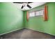 Spare bedroom with orange curtains and ceiling fan at 10155 Orchard Park W Dr, Carmel, IN 46280