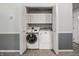 Laundry room with modern front-load washer and dryer at 10155 Orchard Park W Dr, Carmel, IN 46280