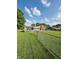 Spacious backyard with pool and chain link fence at 1050 Laguna Ln, Greenwood, IN 46143