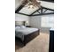 Comfortable bedroom featuring a king bed, vaulted ceilings, and a large window at 1050 Laguna Ln, Greenwood, IN 46143
