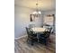 Charming dining room with a decorative chandelier, round table, and a vintage cabinet, ideal for Gathering meals at 1050 Laguna Ln, Greenwood, IN 46143