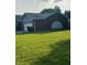 Brick home with attached garage and well maintained lawn at 1050 Laguna Ln, Greenwood, IN 46143