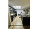 Modern kitchen with black cabinetry, granite countertops, stainless steel appliances and a skylight at 1050 Laguna Ln, Greenwood, IN 46143