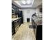 Contemporary kitchen boasting dark cabinets, granite countertops, stainless steel appliances and updated flooring at 1050 Laguna Ln, Greenwood, IN 46143
