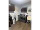 Laundry room showcasing modern washer/dryer, dark cabinets, utility sink, and decor at 1050 Laguna Ln, Greenwood, IN 46143