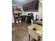 Well-organized laundry room with dark cabinets, utility sink, and shelving for storage at 1050 Laguna Ln, Greenwood, IN 46143