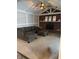 Cozy living room featuring a vaulted ceiling, brick fireplace, and comfortable seating, perfect for relaxation at 1050 Laguna Ln, Greenwood, IN 46143
