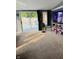 Sun-filled living room with sliding glass doors to deck, and a mounted television at 1050 Laguna Ln, Greenwood, IN 46143