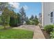 Private backyard patio surrounded by lush trees and lawn at 1246 Valdosta Pl, Westfield, IN 46074