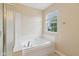 Bathroom features a tub, shower, and window at 1246 Valdosta Pl, Westfield, IN 46074