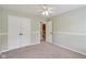 Bedroom featuring neutral walls, carpet flooring, a ceiling fan, and a large closet at 1246 Valdosta Pl, Westfield, IN 46074