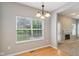Dining area with hardwood floors, backyard view, and convenient access to the living room at 1246 Valdosta Pl, Westfield, IN 46074