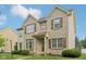 Charming two-story brick home with a well-manicured lawn and decorative shutters at 1246 Valdosta Pl, Westfield, IN 46074