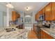 Open kitchen featuring granite countertops, a tile backsplash, and stainless steel appliances at 1246 Valdosta Pl, Westfield, IN 46074