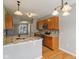 Kitchen featuring granite countertops, a tile backsplash, hardwood flooring, and wooden cabinets at 1246 Valdosta Pl, Westfield, IN 46074