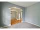 Open-concept living room featuring neutral walls, carpet flooring, and an open archway at 1246 Valdosta Pl, Westfield, IN 46074