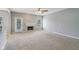 Spacious living room with neutral carpet, fireplace, and natural light from the sliding glass door at 1246 Valdosta Pl, Westfield, IN 46074