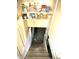 View down stairs to the unfinished basement at 130 S Arlington Ave, Indianapolis, IN 46219