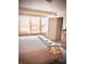 Bright bedroom with a large bed, featuring bright windows, and a dresser at 130 S Arlington Ave, Indianapolis, IN 46219