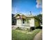 Side view of a bungalow featuring a front porch and a small, unkempt yard at 130 S Arlington Ave, Indianapolis, IN 46219