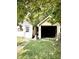 Side-by-side garages with grass driveway at 130 S Arlington Ave, Indianapolis, IN 46219