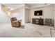 Basement Gathering room featuring a recliner, TV, and shelves for media at 14030 Old Mill Ct, Carmel, IN 46032
