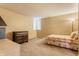 Bedroom with neutral walls, carpet, and furniture including dressers and a bed at 14030 Old Mill Ct, Carmel, IN 46032